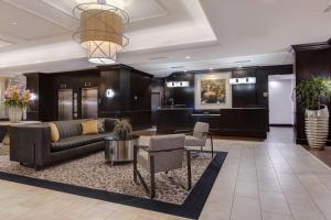 a lobby with a couch and a table and chairs at Homewood Suites Nashville Vanderbilt in Nashville