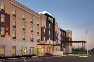 a rendering of a hotel with a parking lot at Home2 Suites By Hilton Florence Cincinnati Airport South in Florence