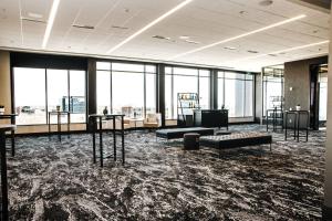 a large room with a lot of windows at AC Hotel by Marriott Columbus Downtown in Columbus