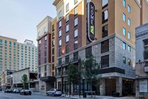 a building with a sign on the side of a street at Hampton Inn & Suites San Antonio Riverwalk in San Antonio