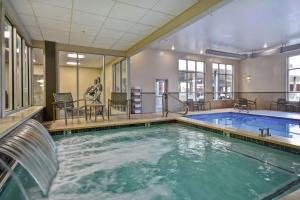 a indoor pool with a water slide in a building at Homewood Suites by Hilton Moab in Moab