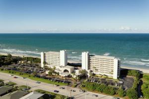 an aerial view of a hotel and the ocean at DoubleTree Suites by Hilton Melbourne Beach Oceanfront in Melbourne