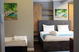 Postel nebo postele na pokoji v ubytování biglife hotel