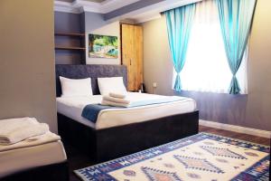 Postel nebo postele na pokoji v ubytování biglife hotel + 37 fotografií