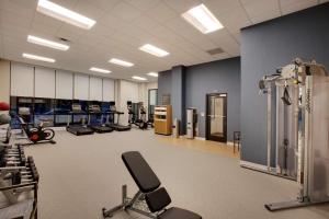 a gym with several treadmills and exercise bikes at Homewood Suites By Hilton Louisville Downtown in Louisville