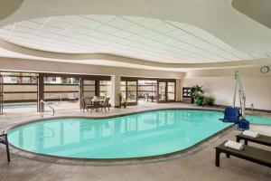 a large swimming pool in a building with a domed ceiling at Embassy Suites by Hilton Convention Center Las Vegas in Las Vegas