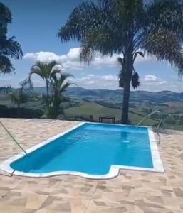 Het zwembad bij of vlak bij Sítio Chalé 3Ipes