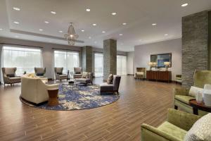 a large lobby with couches and chairs at Homewood Suites by Hilton Albany Crossgates Mall in Albany