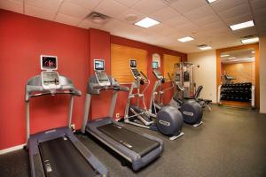 a gym with several cardio machines in a room at Hilton Garden Inn Athens Downtown in Athens