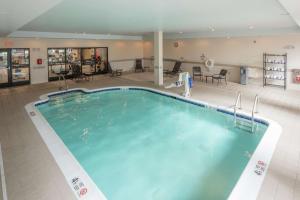 a large swimming pool in a hotel lobby at Hilton Garden Inn Albany Medical Center in Albany
