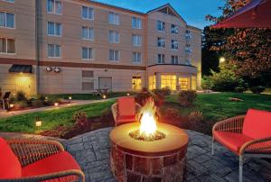 a fire pit in front of a building at Hilton Garden Inn Saratoga Springs in Saratoga Springs