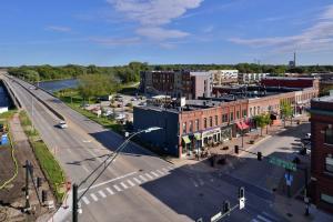 an aerial view of a city with a street at Hampton Inn Cedar Falls Downtown, Ia in Cedar Falls