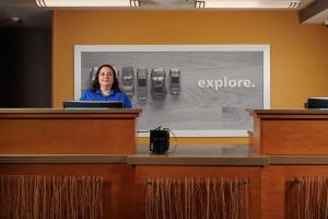 a woman is standing at a podium at Hampton Inn Alamogordo in Alamogordo