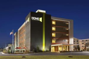 a large building with a home healthcare sign on it at Home2 Suites by Hilton - Oxford in Oxford
