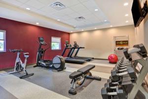 a gym with treadmills and cardio equipment in a room at Home2 Suites By Hilton Naples I-75 Pine Ridge Road in Naples
