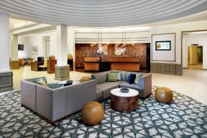 a living room with a couch and a table at DoubleTree by Hilton Nashua in Nashua