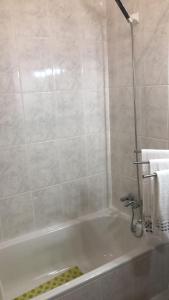 a bathroom with a bath tub with a sink at SPA - Casa do Avo BESELGA in Santo Amaro +39 photos