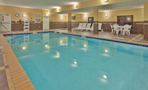 a large swimming pool in a hotel room at Hampton Inn & Suites Watertown in Watertown