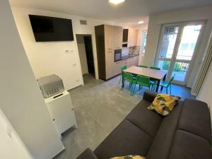 a living room with a couch and a table at Casa Mattia in Bellano