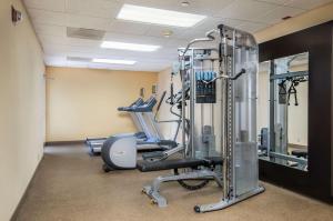 a gym with several tread machines and a mirror at Homewood Suites by Hilton Austin South in Austin