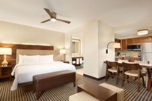 a hotel room with a bed and a kitchen at Homewood Suites By Hilton Augusta in Augusta +35 photos