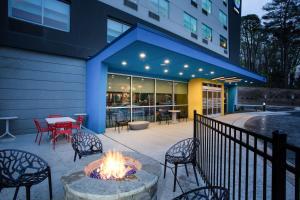 a fire pit in front of a building at Tru By Hilton Asheville East, NC in Asheville