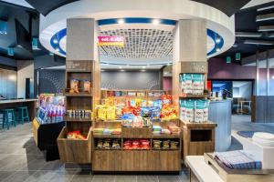 a grocery store with a display of food at Tru By Hilton Asheville East, NC in Asheville