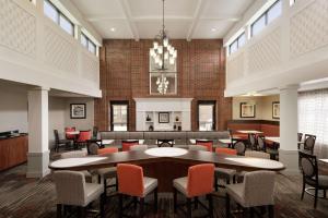 a large room with a table and chairs at Homewood Suites by Hilton Newtown - Langhorne, PA in Newtown