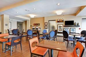a waiting room at a hospital with tables and chairs at Hampton Inn Scranton at Montage Mountain in Scranton