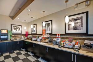 a restaurant with a counter with food on it at Hampton Inn Scranton at Montage Mountain in Scranton