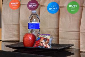 a bottle of water and an apple on a tray at Hampton Inn & Suites - Columbia South, MD in Columbia