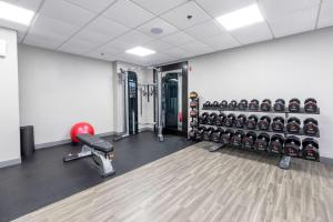 a room with a gym with a lot of equipment at Hampton Inn Swedesboro Philadelphia in Swedesboro