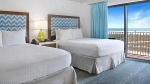 Ένα ή περισσότερα κρεβάτια σε δωμάτιο στο Bilmar Beach Resort