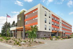 a rendering of the front of a hotel at Home2 Suites By Hilton Bismarck in Bismarck