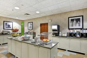 a kitchen with a counter with food on it at Hampton Inn Bloomsburg in Bloomsburg