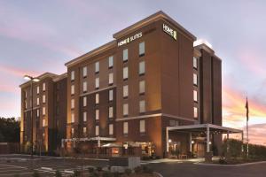 a hotel building with a sign on top of it at Home2 Suites by Hilton Nashville Franklin Cool Springs in Franklin