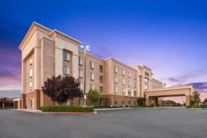 a large building with a parking lot in front of it at Hampton Inn & Suites Banning/Beaumont in Banning