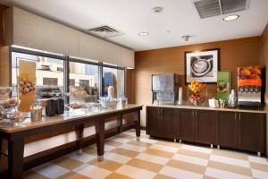 a kitchen with a counter with food on it at Hampton Inn Boston/Braintree in Braintree