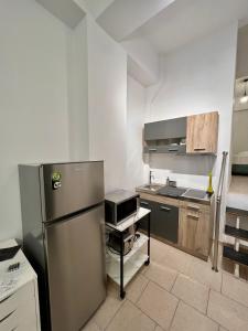 a kitchen with a stainless steel refrigerator at Domus Bettolo in Chania Town