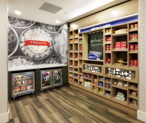 a grocery store with aries mural on the wall at Hampton Inn Boston-Natick in Natick +34 photos