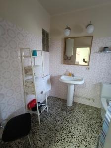 a bathroom with a sink and a shelf and a mirror at Apartamento en Terrades, Empordà in Terrades