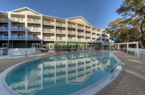 a large swimming pool in front of a hotel at Hampton Inn & Suites Jekyll Island in Jekyll Island