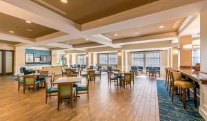 a large dining room with tables and chairs at Hampton Inn & Suites Jekyll Island in Jekyll Island