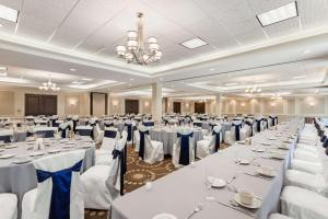 a banquet hall with white tables and chairs at Hampton Inn Burlington - Colchester in Burlington