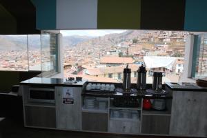 Virtuvė arba virtuvėlė apgyvendinimo įstaigoje Cuscopackers Hostels
