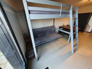 an overhead view of a bunk bed with a desk at Les saisies-gîte les carolos in Les Saisies