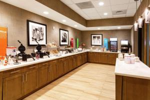 a hair salon with wooden cabinets and a large room at Hampton Inn & Suites By Hilton-Columbia Killian Road in Killian