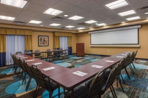 a conference room with tables and chairs and a whiteboard at Hampton Inn Clearfield in Clearfield