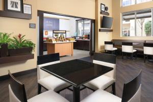 a dining room with a table and chairs at Hampton Inn & Suites Chattanooga Downtown in Chattanooga