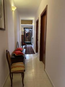 a hallway with a couch and chairs in a room at Guest House Pitagora in Rome